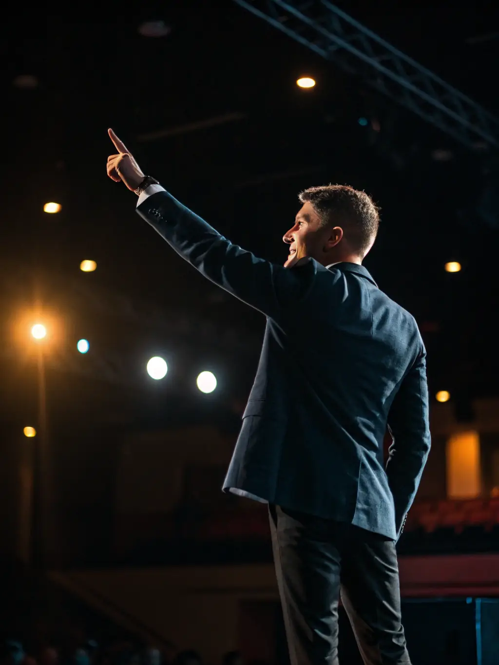 A business coach delivering a motivational speech to a group of UK business owners at a networking event, inspiring them to achieve their business goals and overcome challenges.
